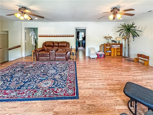 15157 Bass Cove Rd, Gravois Mills, MO 65037 - living area with ceiling fan, wood finished floors, and baseboards