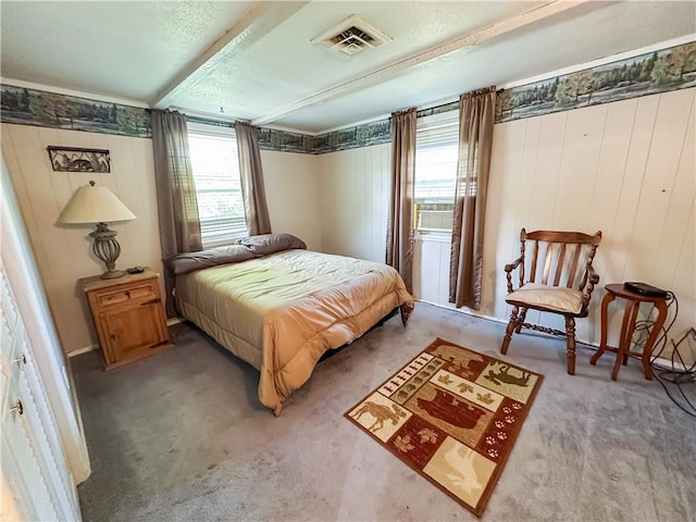 15157 Bass Cove Rd, Gravois Mills, MO 65037 - bedroom featuring multiple windows, carpet flooring, a textured ceiling, and wooden walls