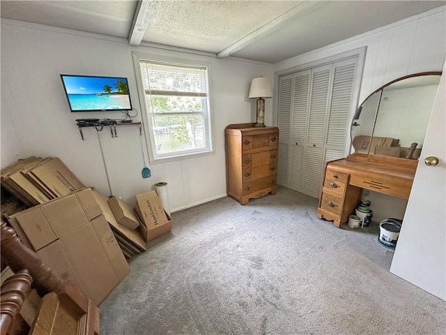 15157 Bass Cove Rd, Gravois Mills, MO 65037 - carpeted bedroom featuring a closet and beamed ceiling