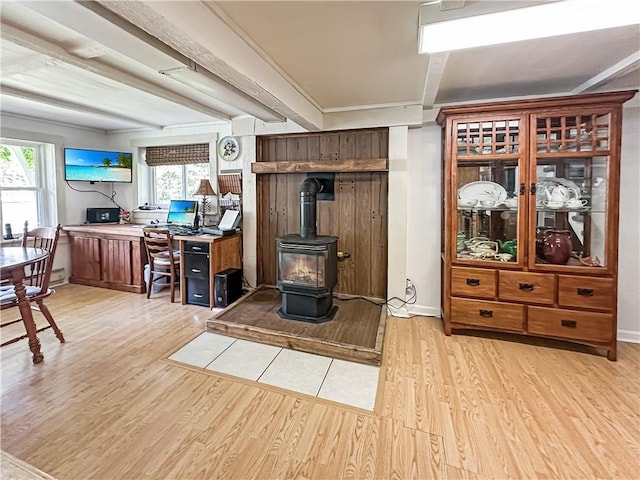 15157 Bass Cove Rd, Gravois Mills, MO 65037 - living room with light wood-style flooring, a wood stove, and healthy amount of natural light