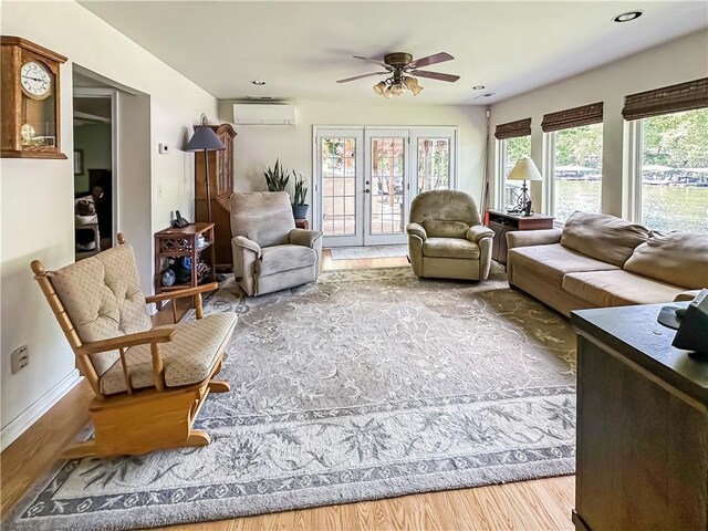15157 Bass Cove Rd, Gravois Mills, MO 65037 - living room featuring an AC wall unit, wood finished floors, a ceiling fan, baseboards, and recessed lighting