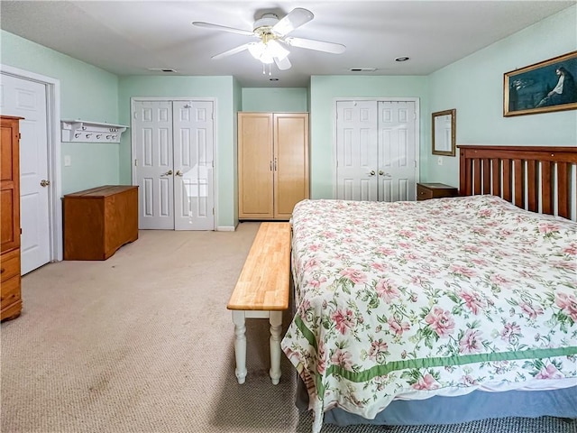 15157 Bass Cove Rd, Gravois Mills, MO 65037 - bedroom featuring light carpet, multiple closets, and ceiling fan