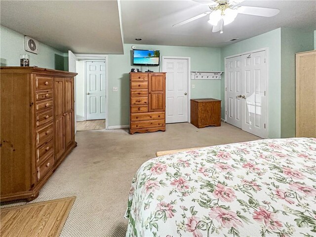 15157 Bass Cove Rd, Gravois Mills, MO 65037 - bedroom with light colored carpet, a ceiling fan, and baseboards