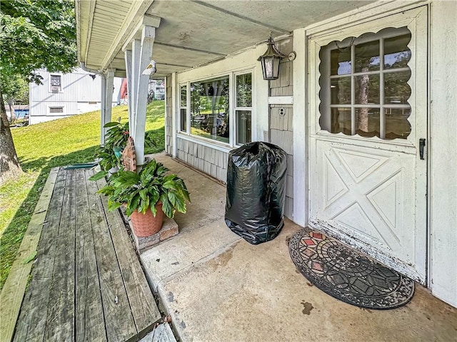 15157 Bass Cove Rd, Gravois Mills, MO 65037 - covered porch featuring a yard and area for grilling
