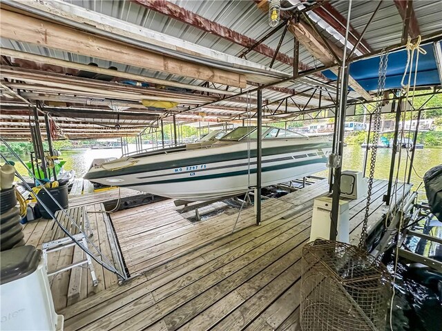 15157 Bass Cove Rd, Gravois Mills, MO 65037 - dock area with boat lift and a water view