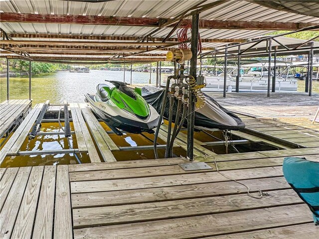 15157 Bass Cove Rd, Gravois Mills, MO 65037 - dock featuring boat lift and a water view