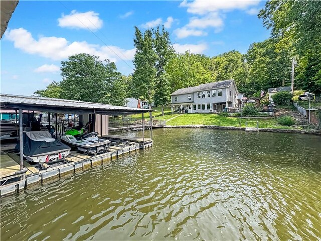 15157 Bass Cove Rd, Gravois Mills, MO 65037 - dock with boat lift, a water view, and a lawn