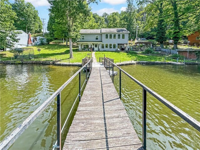 15157 Bass Cove Rd, Gravois Mills, MO 65037 - dock area with a water view and a lawn