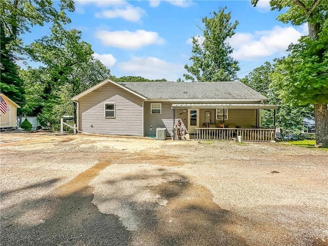 15157 Bass Cove Rd, Gravois Mills, MO 65037 - back of house with central AC, a porch, driveway, and roof with shingles