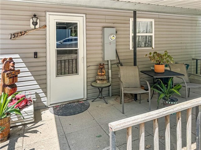 15157 Bass Cove Rd, Gravois Mills, MO 65037 - view of exterior entry with a patio area