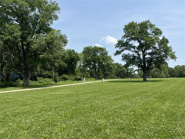 7316 E 109th St, Kansas City, MO 64134 - view of property's community featuring a lawn and view of scattered trees
