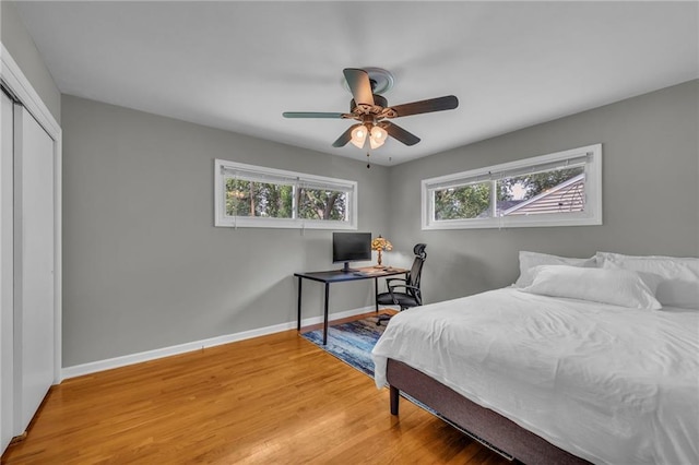 7316 E 109th St, Kansas City, MO 64134 - bedroom with a closet, light wood-style floors, baseboards, and a ceiling fan