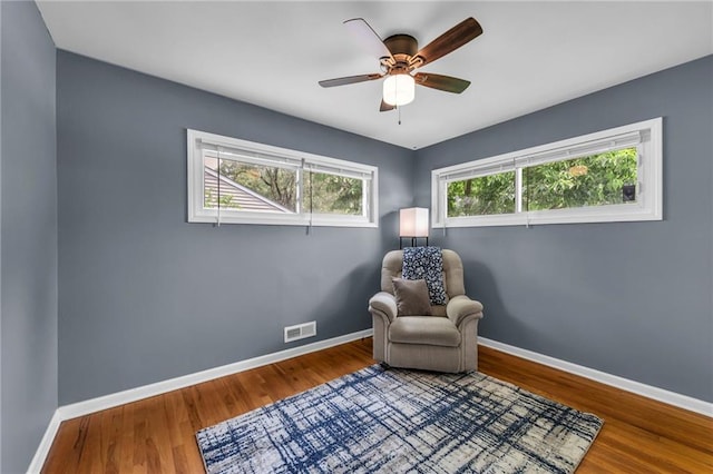 7316 E 109th St, Kansas City, MO 64134 - living area featuring baseboards, a ceiling fan, and wood finished floors
