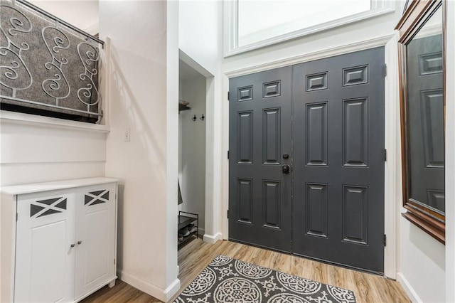 8726 W 104th St, Overland Park, KS 66212 - foyer entrance with light wood-style flooring and baseboards