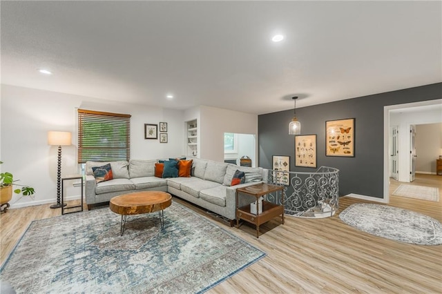 8726 W 104th St, Overland Park, KS 66212 - living area with light wood-type flooring, baseboards, recessed lighting, and plenty of natural light
