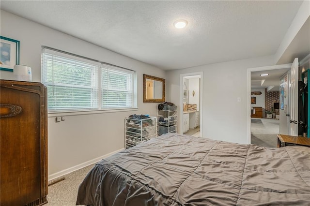 8726 W 104th St, Overland Park, KS 66212 - carpeted bedroom with a textured ceiling, baseboards, and ensuite bathroom