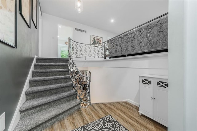 8726 W 104th St, Overland Park, KS 66212 - stairway with wood finished floors and baseboards