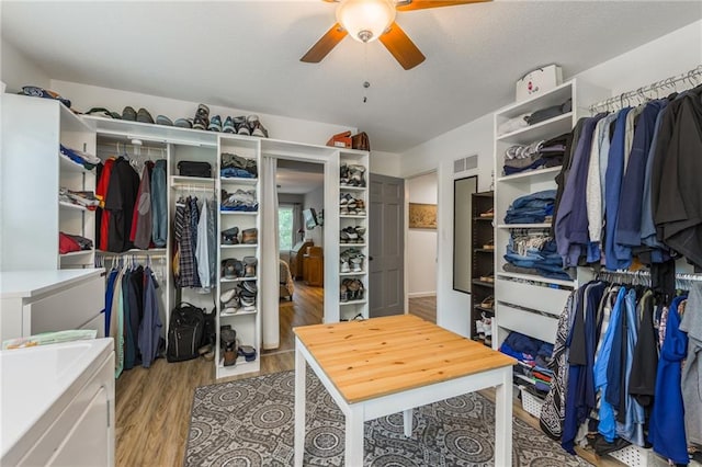 8726 W 104th St, Overland Park, KS 66212 - spacious closet with ceiling fan and wood finished floors