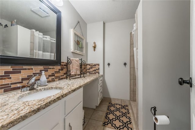 8726 W 104th St, Overland Park, KS 66212 - full bathroom featuring vanity, backsplash, tile patterned flooring, a shower, and a textured ceiling