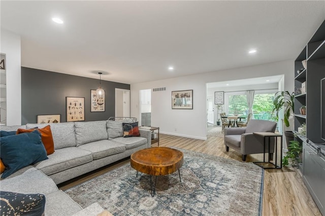 8726 W 104th St, Overland Park, KS 66212 - living room with light wood-style floors, recessed lighting, and baseboards