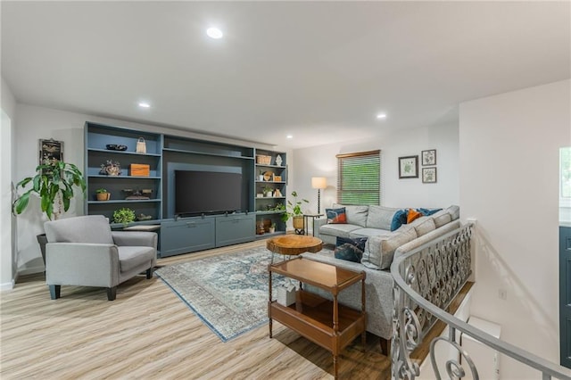 8726 W 104th St, Overland Park, KS 66212 - living area featuring light wood-style flooring, recessed lighting, and plenty of natural light