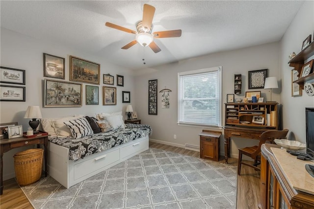 8726 W 104th St, Overland Park, KS 66212 - living room with light wood finished floors, ceiling fan, a textured ceiling, and baseboards