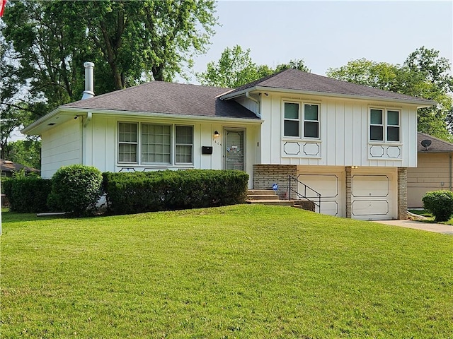 7605 E 93rd St, Kansas City, MO 64138 - split level home with an attached garage, a front lawn, board and batten siding, and driveway
