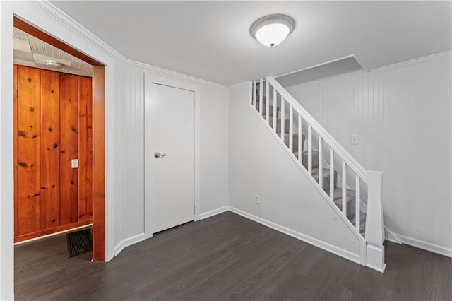 7 NW 88th St, Kansas City, MO 64155 - below grade area with wood finished floors, stairs, baseboards, and crown molding