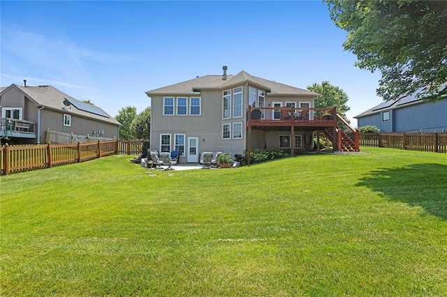 8108 NE 113th St, Kansas City, MO 64157 - back of property with stairway, a wooden deck, a fenced backyard, and a patio