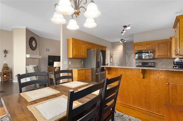 8108 NE 113th St, Kansas City, MO 64157 - dining room with light wood-style flooring and a chandelier