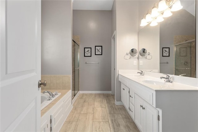 8108 NE 113th St, Kansas City, MO 64157 - full bathroom featuring a shower stall, a garden tub, double vanity, and a chandelier