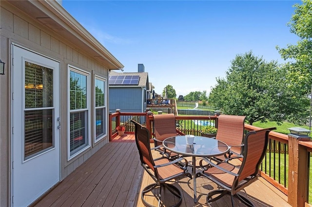 8108 NE 113th St, Kansas City, MO 64157 - wooden terrace with outdoor dining space