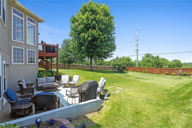 8108 NE 113th St, Kansas City, MO 64157 - fenced backyard featuring an outdoor hangout area, stairway, a patio area, and a deck