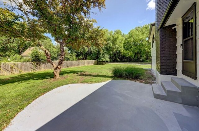 10409 Russell St, Overland Park, KS 66212 - view of patio / terrace with view of wooded area