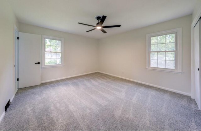 10409 Russell St, Overland Park, KS 66212 - carpeted empty room featuring ceiling fan and baseboards