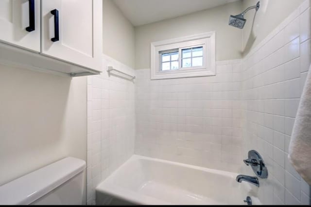 10409 Russell St, Overland Park, KS 66212 - bathroom featuring toilet and shower / washtub combination