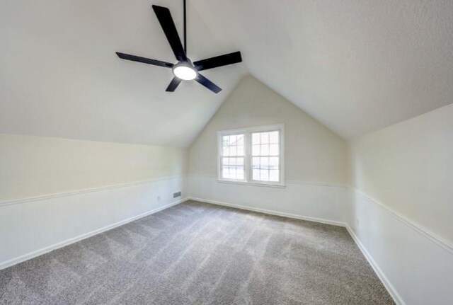 10409 Russell St, Overland Park, KS 66212 - bonus room with carpet floors, a ceiling fan, lofted ceiling, and baseboards