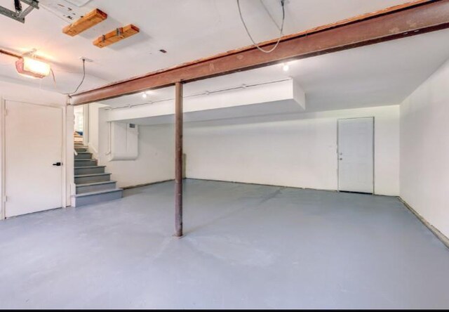 10409 Russell St, Overland Park, KS 66212 - finished below grade area featuring stairway