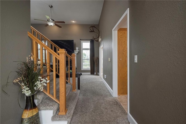 130 SW 95th Rd, Warrensburg, MO 64093 - corridor featuring a textured wall, stairway, carpet, and baseboards