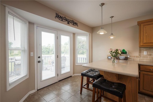 130 SW 95th Rd, Warrensburg, MO 64093 - dining room with baseboards and light tile patterned flooring