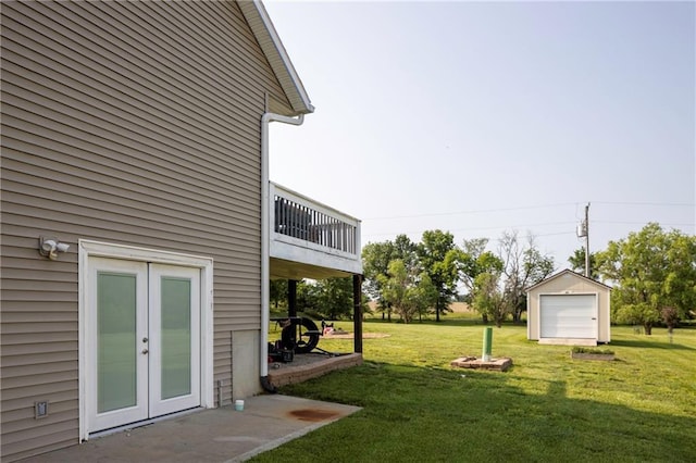 130 SW 95th Rd, Warrensburg, MO 64093 - view of grassy yard featuring a garage and french doors