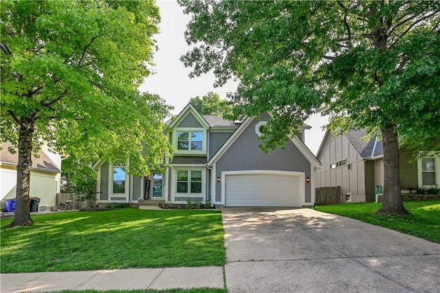 17586 W 112th St, Olathe, KS 66061 - view of front of house featuring concrete driveway, stucco siding, a front lawn, and an attached garage