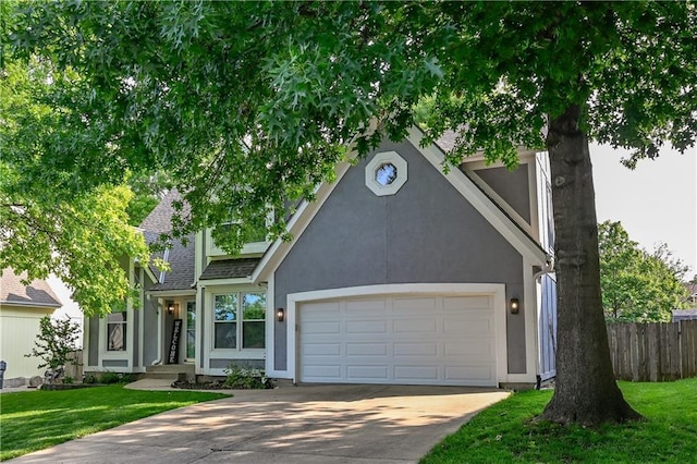 17586 W 112th St, Olathe, KS 66061 - view of front of property with driveway, an attached garage, stucco siding, and a shingled roof