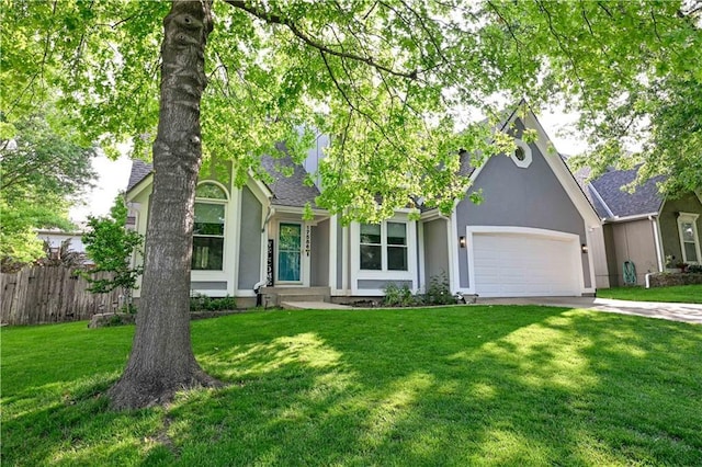 17586 W 112th St, Olathe, KS 66061 - view of front facade featuring stucco siding, an attached garage, driveway, and roof with shingles
