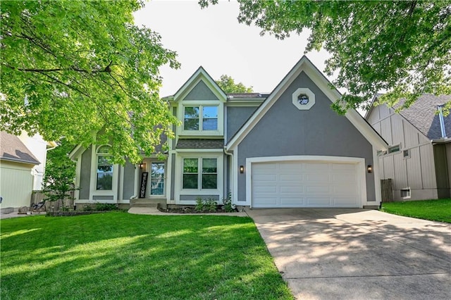 17586 W 112th St, Olathe, KS 66061 - view of front of home featuring stucco siding, concrete driveway, an attached garage, and a front yard