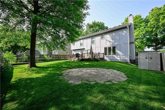 17586 W 112th St, Olathe, KS 66061 - back of property with a chimney, a wooden deck, a patio area, and central air condition unit