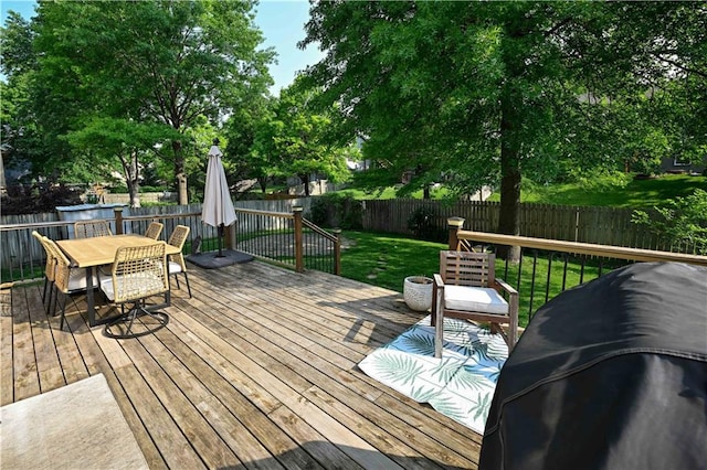 17586 W 112th St, Olathe, KS 66061 - wooden terrace with outdoor dining area and grilling area