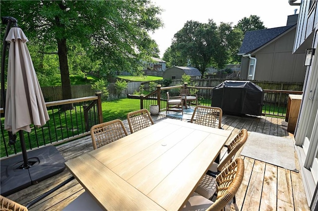 17586 W 112th St, Olathe, KS 66061 - wooden deck with outdoor dining area and a grill