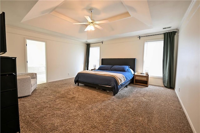 17586 W 112th St, Olathe, KS 66061 - carpeted bedroom featuring a tray ceiling, baseboards, ceiling fan, and ornamental molding