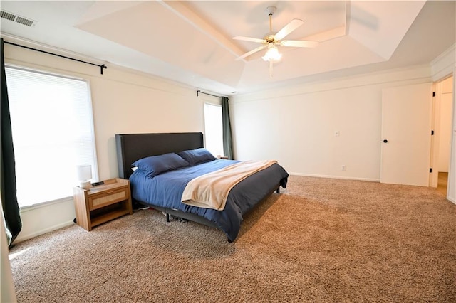 17586 W 112th St, Olathe, KS 66061 - carpeted bedroom with a tray ceiling, a ceiling fan, and baseboards